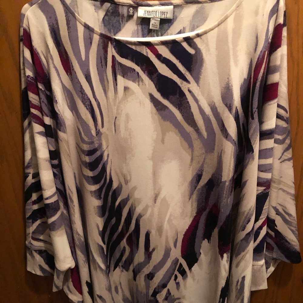 Jennifer Lopez knit top with winged sleeves